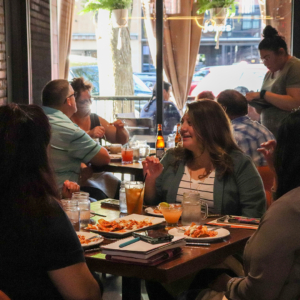 Group of people eating at 411 Restaurant & Lounge