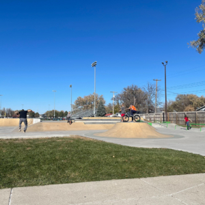 People doing tricks on bikes and skateboards at the Norfolk Skate Park