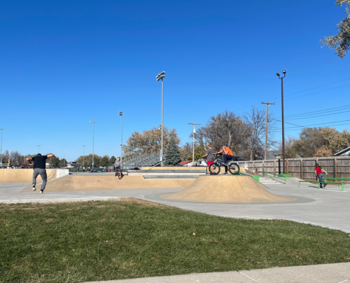 People doing tricks on bikes and skateboards at the Norfolk Skate Park